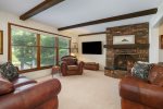 Family room with comfortable leather sofas and a flat screen smart TV
